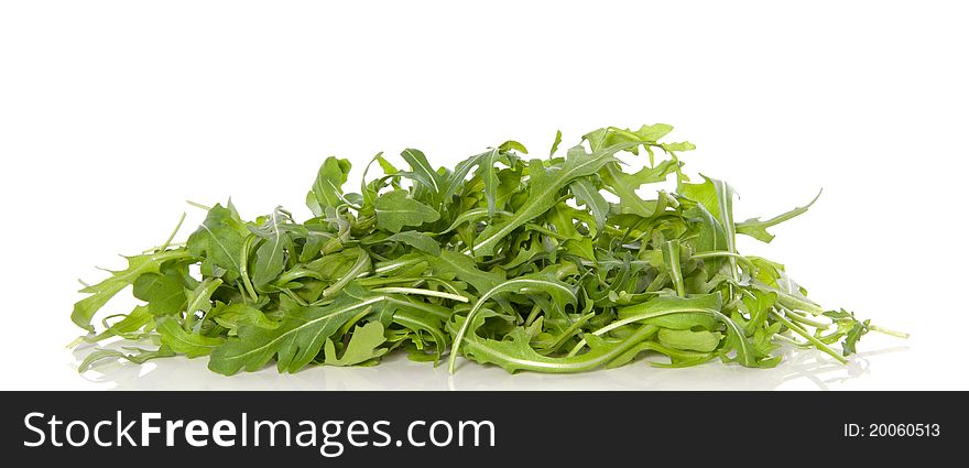 Fresh green rucola lettuce isolated over white background. Fresh green rucola lettuce isolated over white background