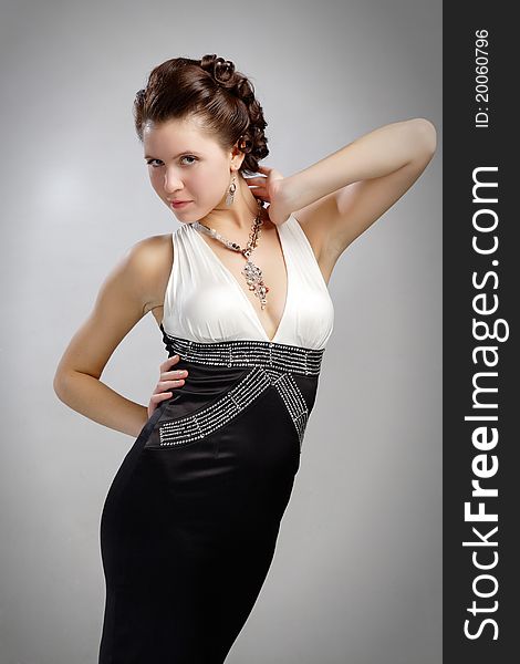 In dress with decollete and bijouterie beads. In dress with decollete and bijouterie beads