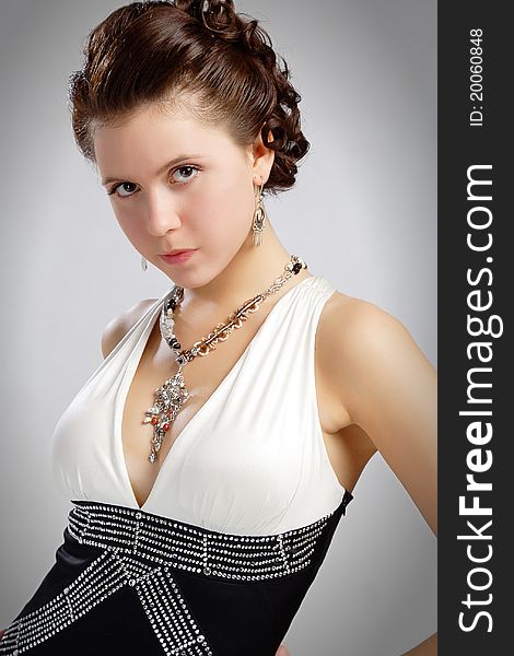 In dress with decollete and bijouterie beads. In dress with decollete and bijouterie beads