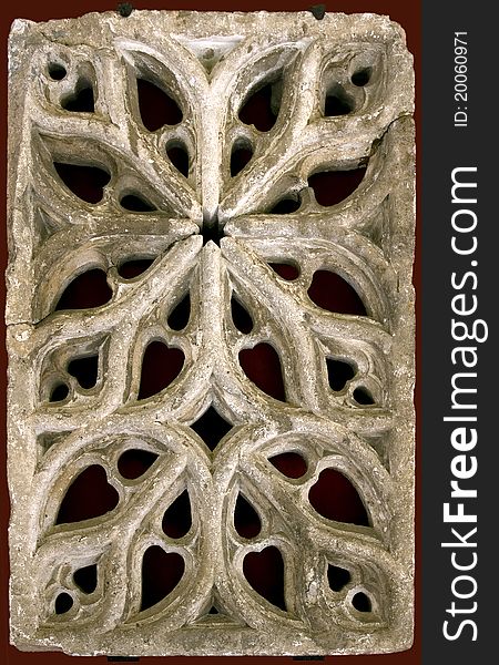 Close up photo of antique stone architectural ornament, detail of ancient building interior.