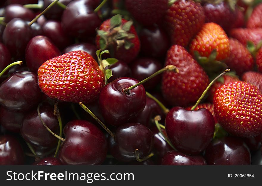 Selection of ripe berries - cherry and strawberry. Selection of ripe berries - cherry and strawberry