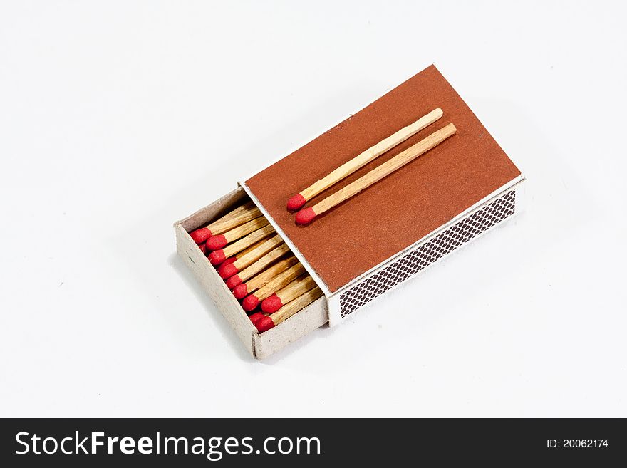 Match and matchsticks in white background.