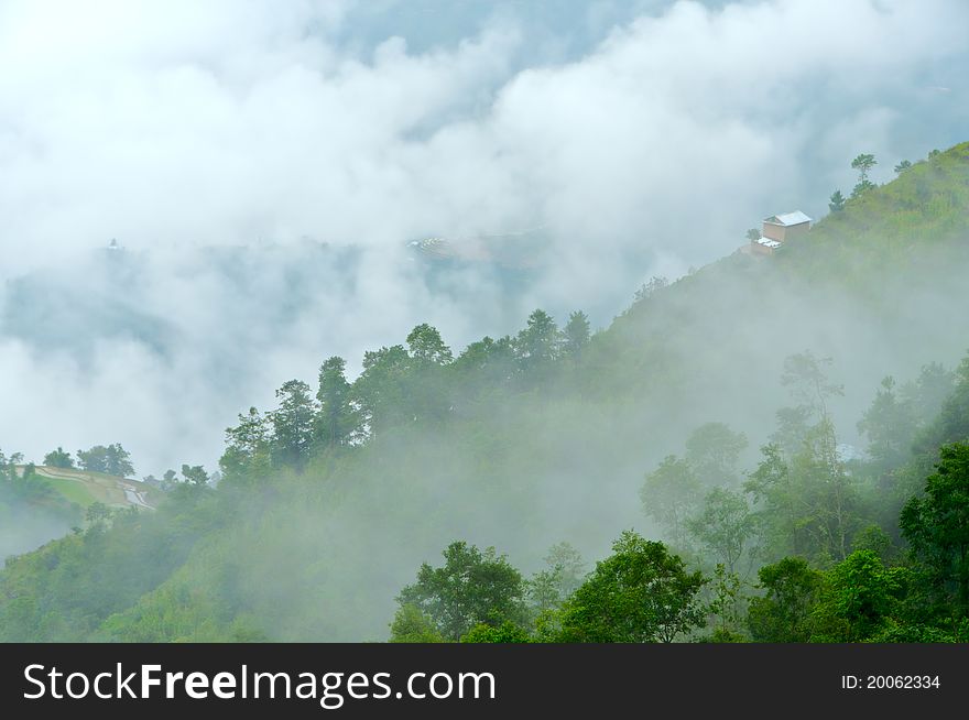 The clouds and fog flow hangs over the mountain scenery. The clouds and fog flow hangs over the mountain scenery