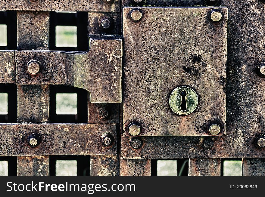 Close up of closed metal door with lock. HDR