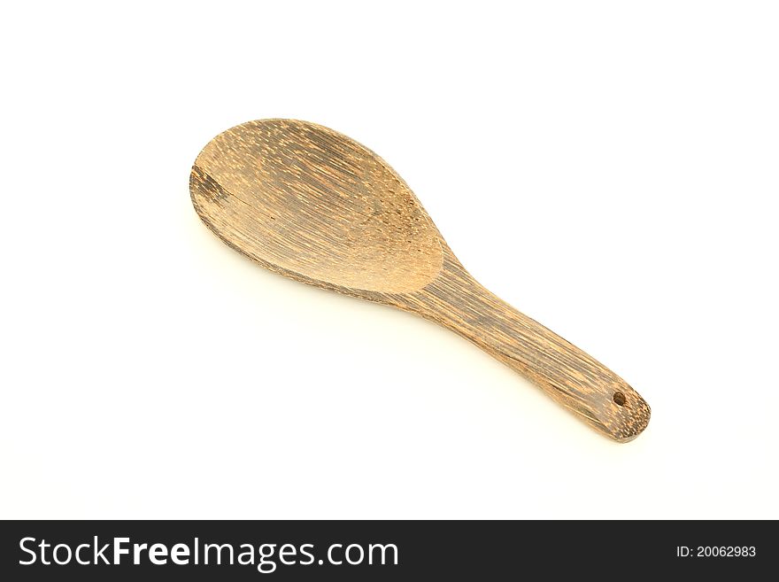 Wooden ladle on a white background