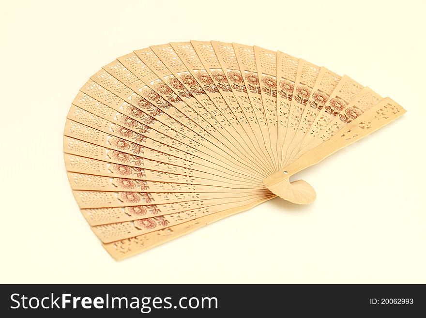 Wooden folding fan isolated on white background