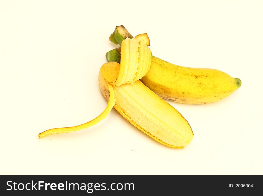 Banana and a peeled on a white background. Banana and a peeled on a white background