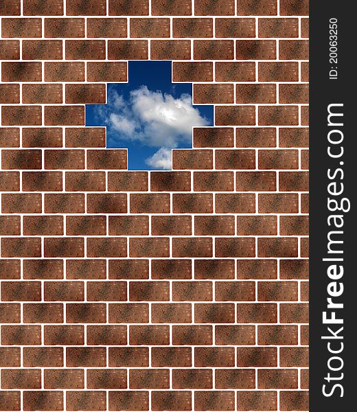 A morning shot of a cloudy blue sky behind a brick wall
