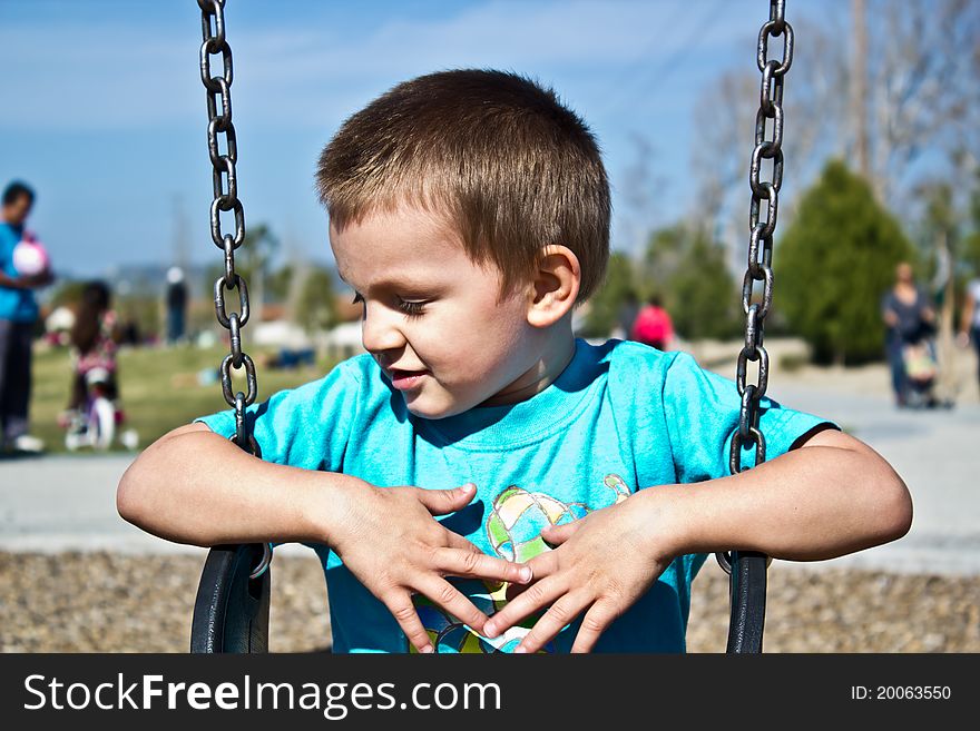 Toddler Sitting on Swing