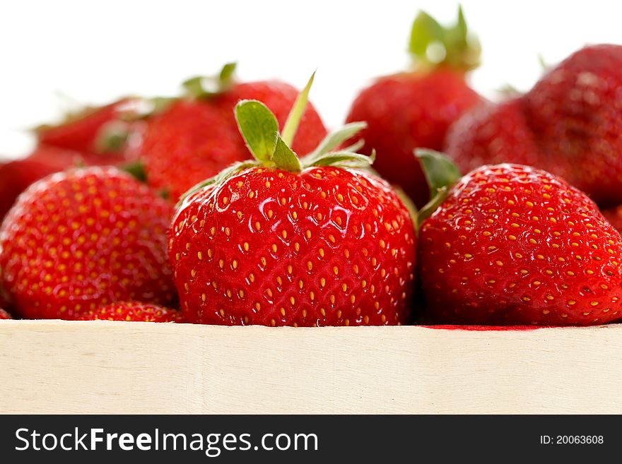 Closeup of fresh ripe strawberries in a wooden box. Closeup of fresh ripe strawberries in a wooden box