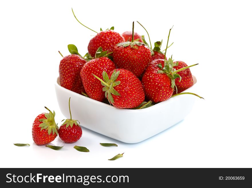 Strawberries in a white bowl, healthy food concept. Strawberries in a white bowl, healthy food concept