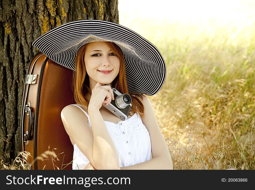 Girl Sitting Near Tree With Vintage Camera.