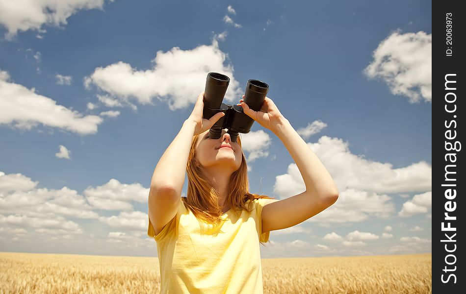 Girl with binocular watching in sky. outdoor