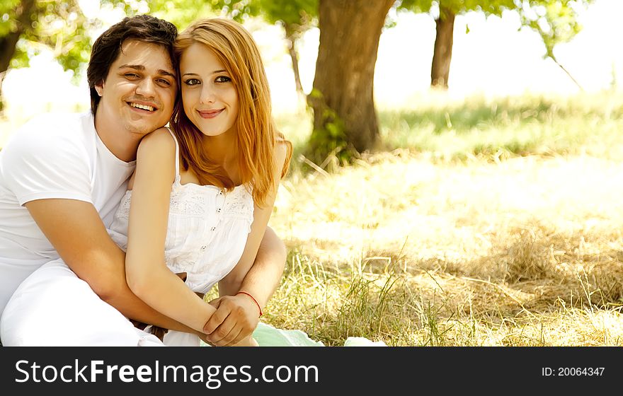 Beautiful couple at park. Outdoor.