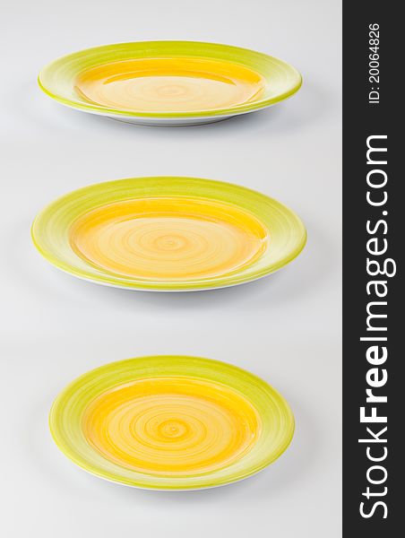 Set of color round plates or dishes on white background
