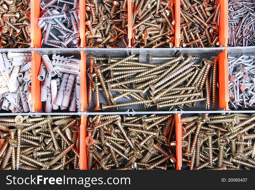 Variety of screws and nails in the box. Variety of screws and nails in the box