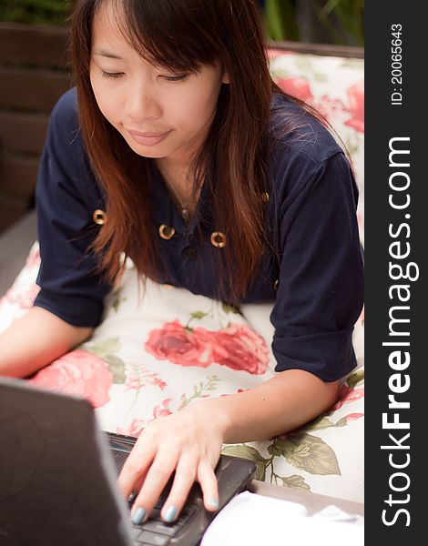 Portrait of young woman working on notebook. Portrait of young woman working on notebook