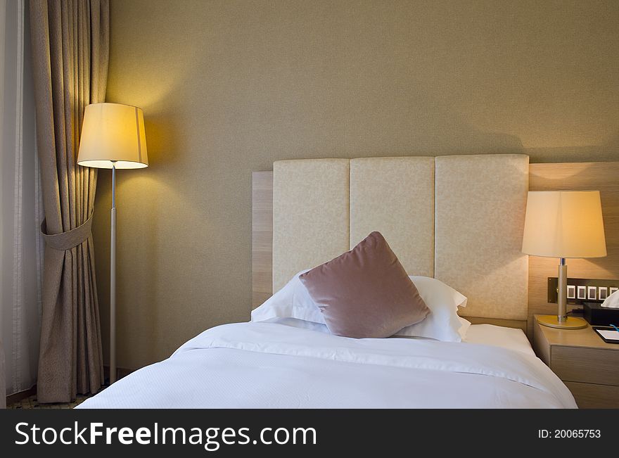 A cozy hotel room with lamps lighted. A cozy hotel room with lamps lighted