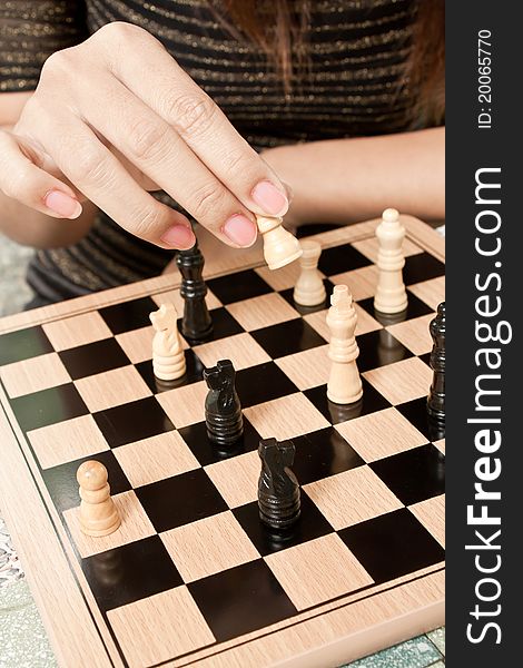 Women playing chess at outdoor