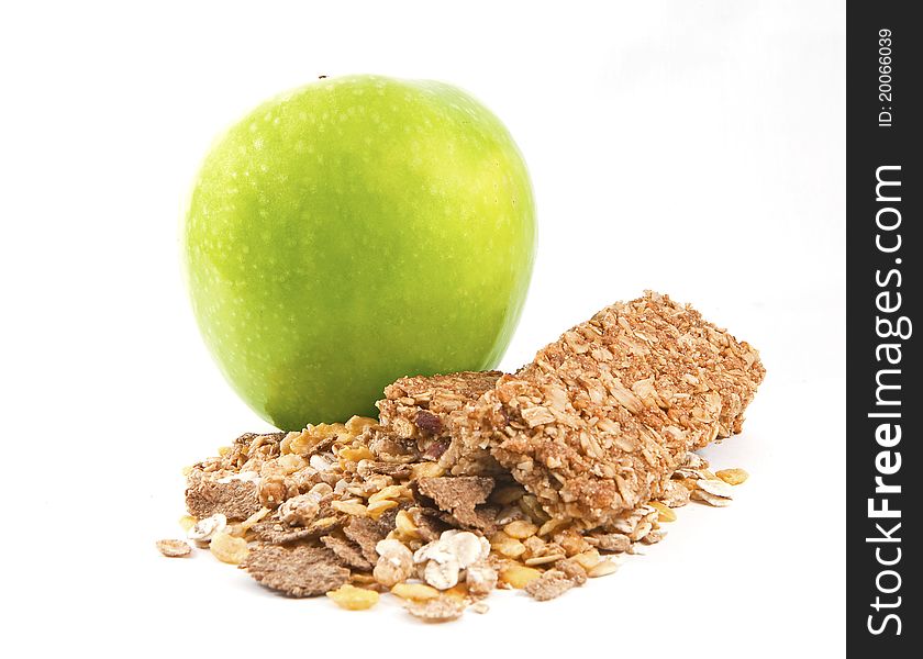 Muesli with green aple on the white background. Muesli with green aple on the white background