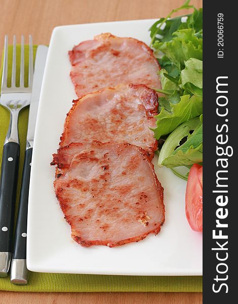 Fried pork with salad on a plate