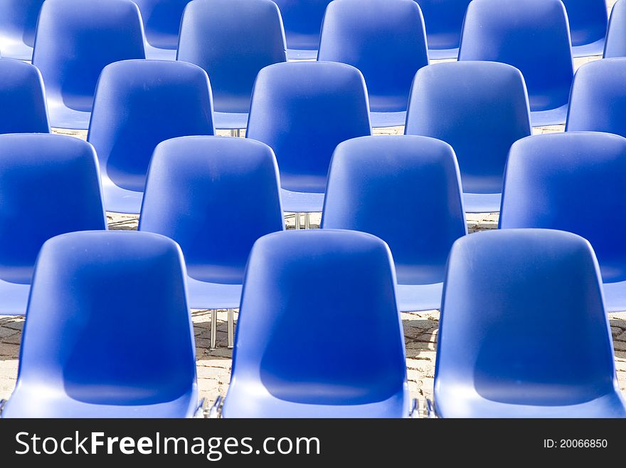 Blue chairs in the square can be used as a background