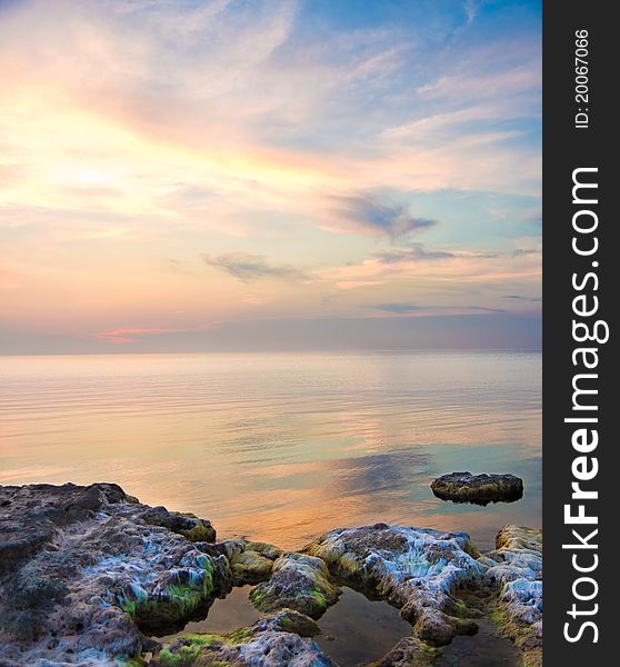 Sea And Rock At The Sunset.