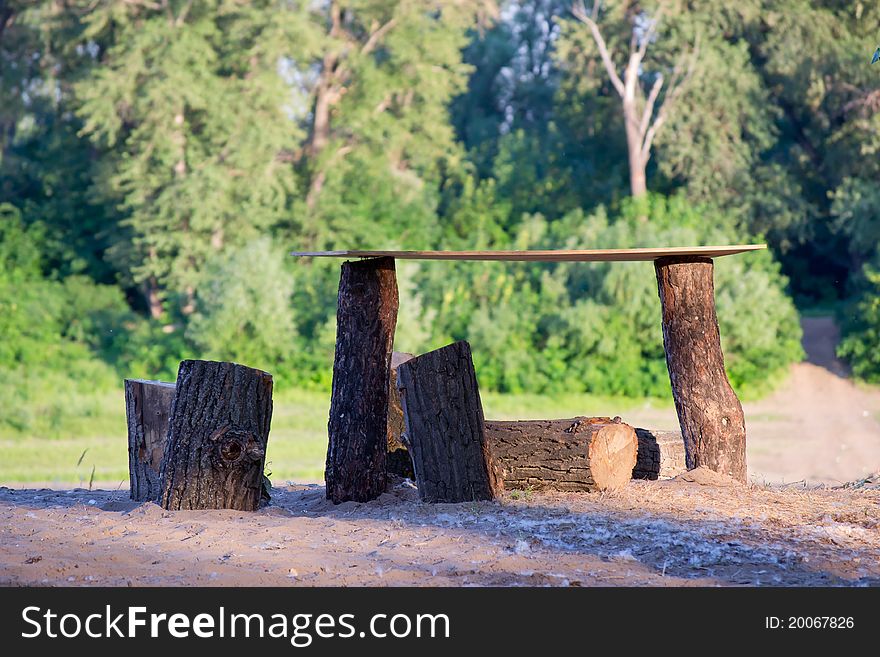 Handmade table made of logs on the nature
