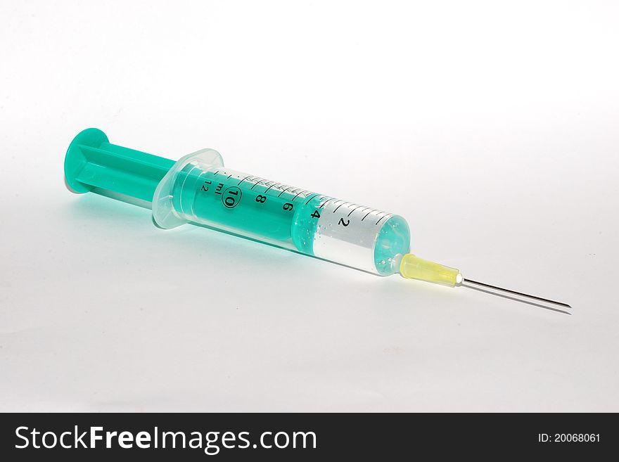 Great view of a syringe filled with medicine prepared for vaccination. Great view of a syringe filled with medicine prepared for vaccination