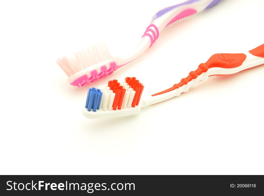 Close-up colorful toothbrush on a white background. Close-up colorful toothbrush on a white background