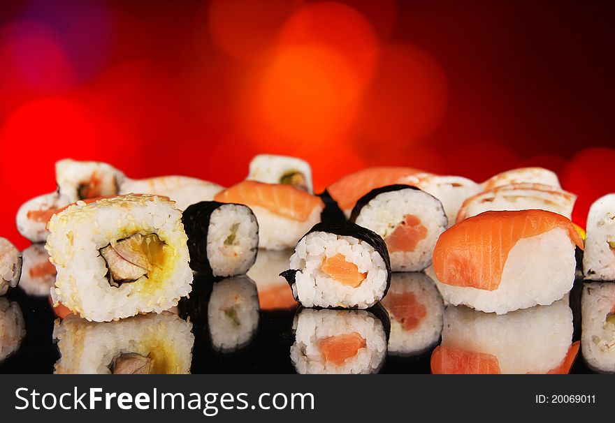 Delicious sushi food on shiny blur background