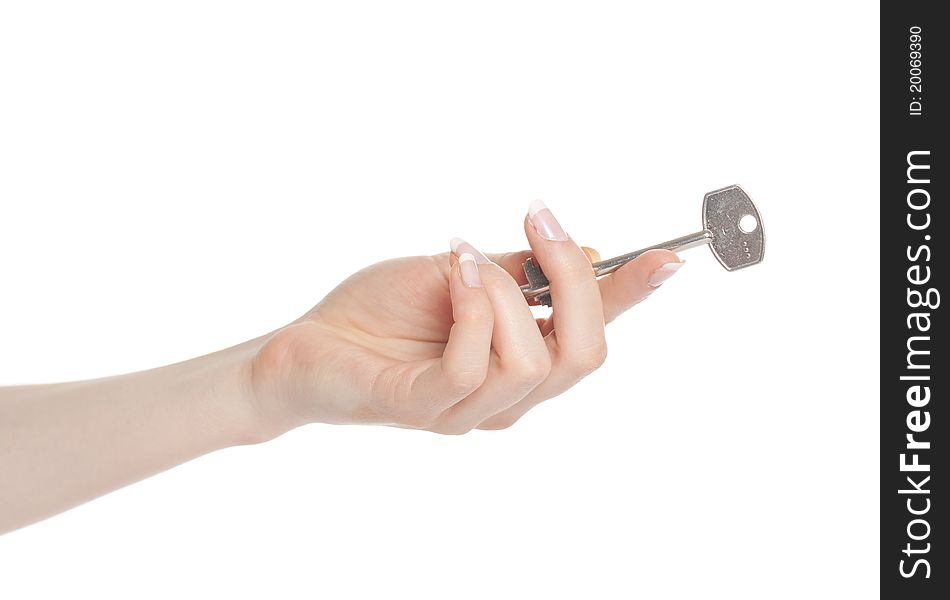 Woman hand holding key and giving it away. Woman hand holding key and giving it away