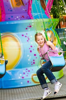 The Beautiful Girl On An Attraction Stock Photo The Beautiful Girl On An Attraction Stock Photo