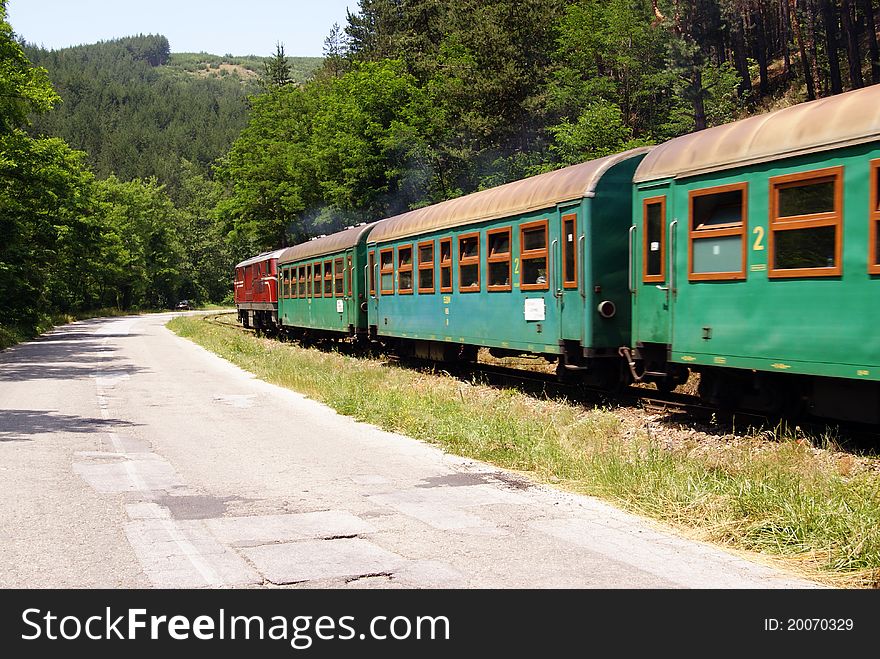 Train and road in bulgaria in pirin national park. Train and road in bulgaria in pirin national park