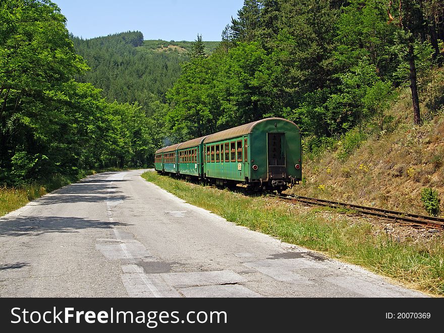 Train and road in bulgaria in pirin national park. Train and road in bulgaria in pirin national park