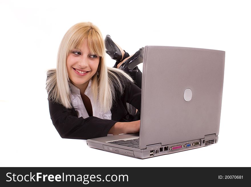 Young Woman Lying And Looking At Laptop