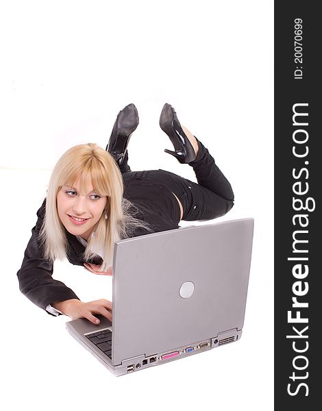 Young woman lying and looking at laptop. Young woman lying and looking at laptop