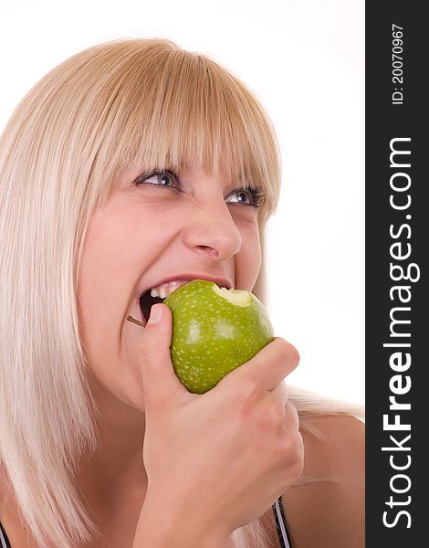 Girl biting the green apple. Girl biting the green apple