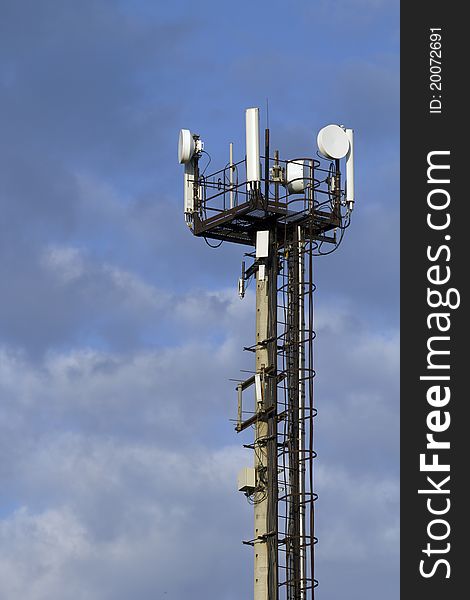 Mast telecommunications equipment  against the sky. Mast telecommunications equipment  against the sky