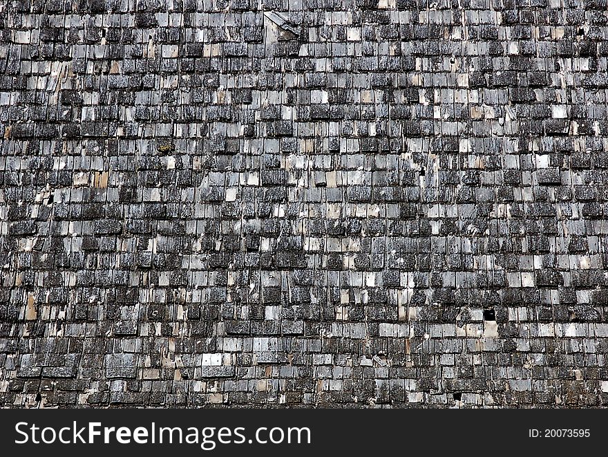 An old cedar shingle barn roof has withstood a century of mother nature. An old cedar shingle barn roof has withstood a century of mother nature