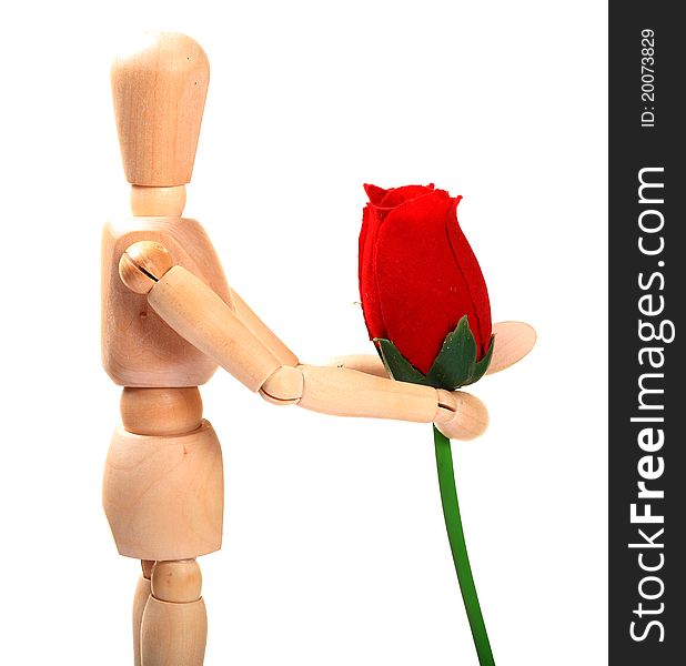 Wooden manniquin holding red rose over white background. Wooden manniquin holding red rose over white background.