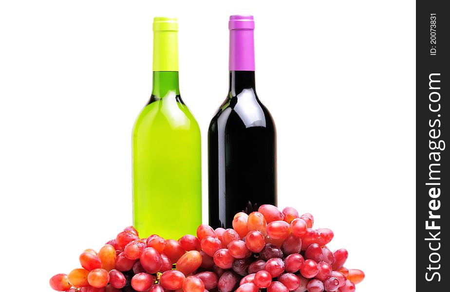 Two bottles of wine and the red grape isolated over white