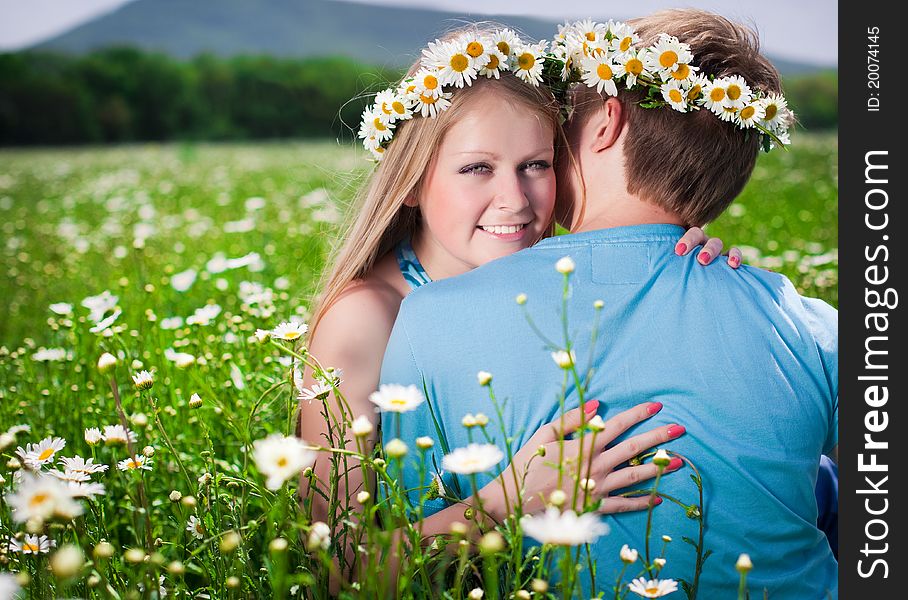 Pretty young couple in the fields