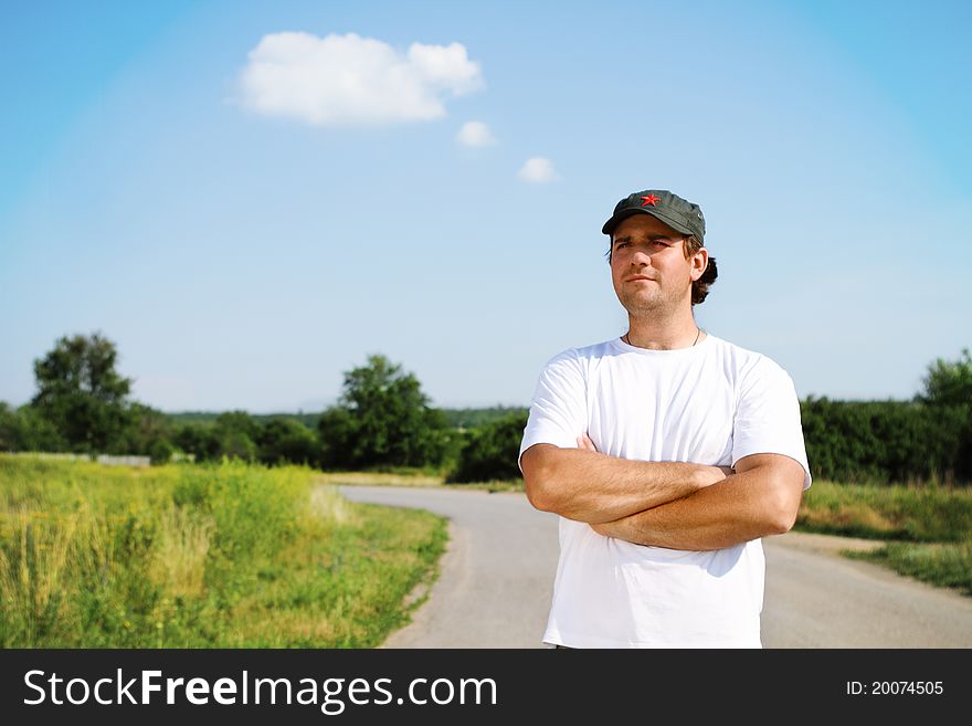 Thinking man outdoors looking forward on the road