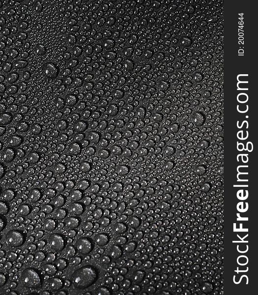 Water Drops On A Metallic Background