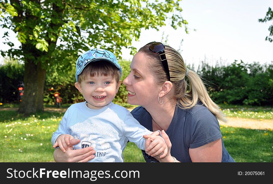 Young boy playing with his mother. Young boy playing with his mother.