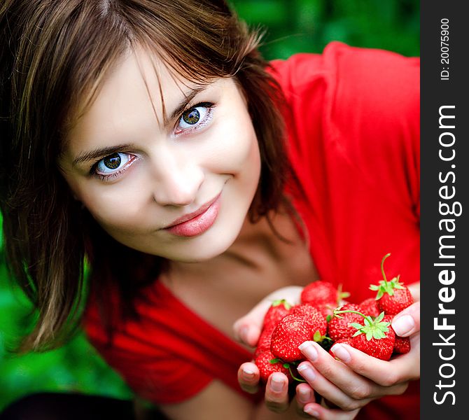 Sweet strawberry in hands