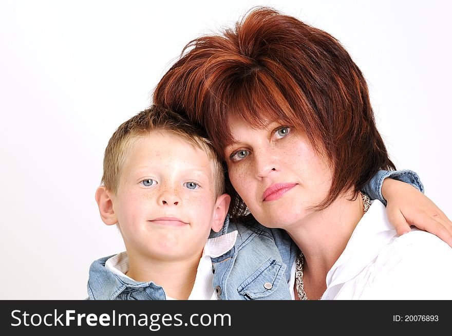 Sexy mother and teen son hugging and smiling