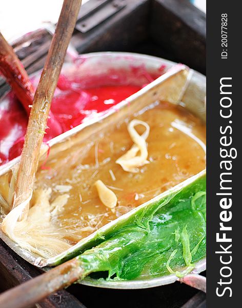 Thai colorful sweetmeat on the boiled pan.