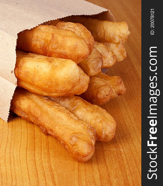 Crispy Crullers In Brown Paper Take Away Bag